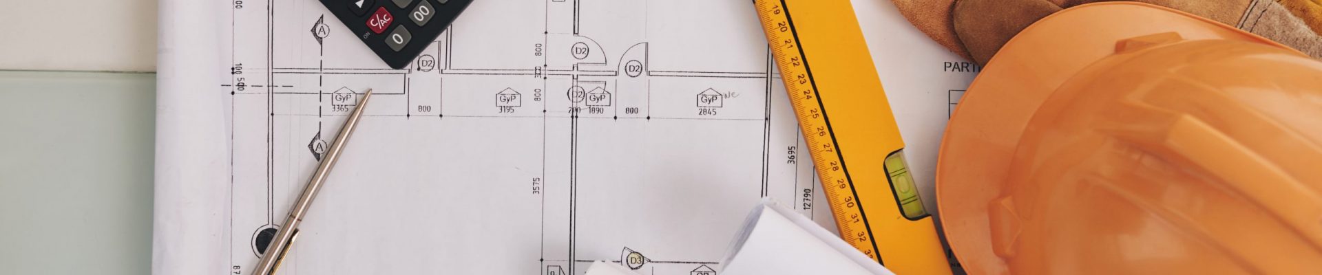 Blueprint, level and belongings of construction engineer